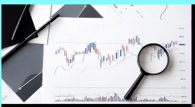 Investment analysis chart and magnifying glass
